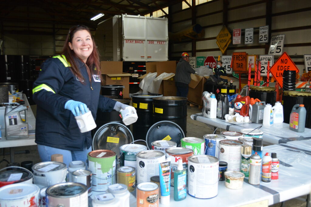 Ross Incineration Services’ QA/QC Manager Heather Baker (left) is all smiles volunteering during Eaton Township’s annual Dumpster Day collection event.